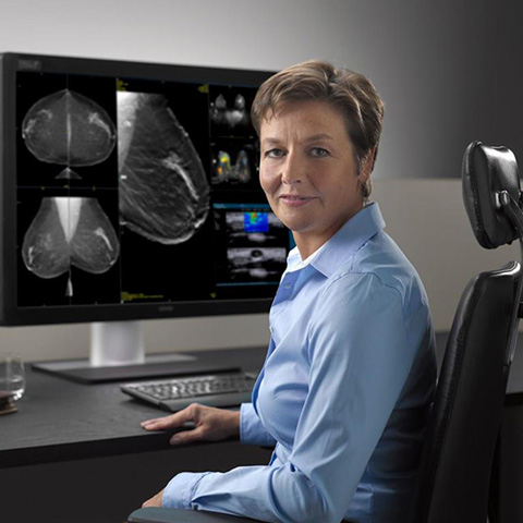 Radiologist using mammography display